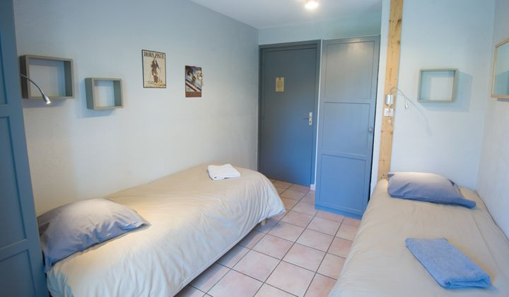 Camera doppia con letti separati del gîte-hôtel Arcanson